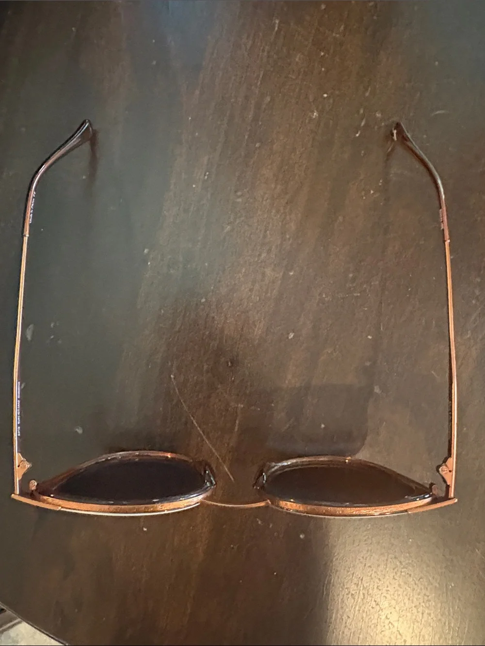 Women's sunski Sunglasses with amber frame and white trim on Black Lenses